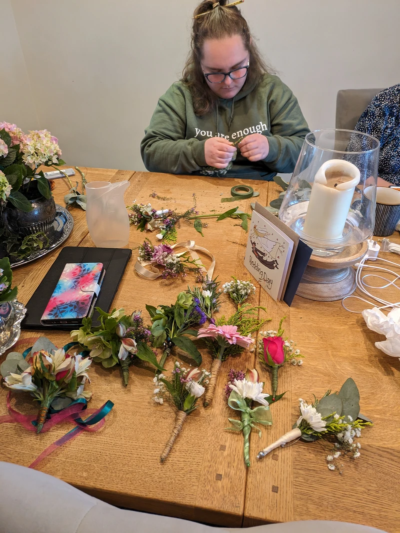 Ellis thinking hard about the design of her flowers