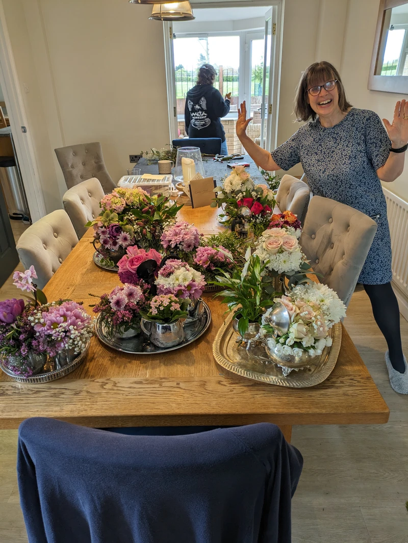 Alison pleased with the results of her efforts organising the flowers